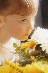 Girl smelling flowers